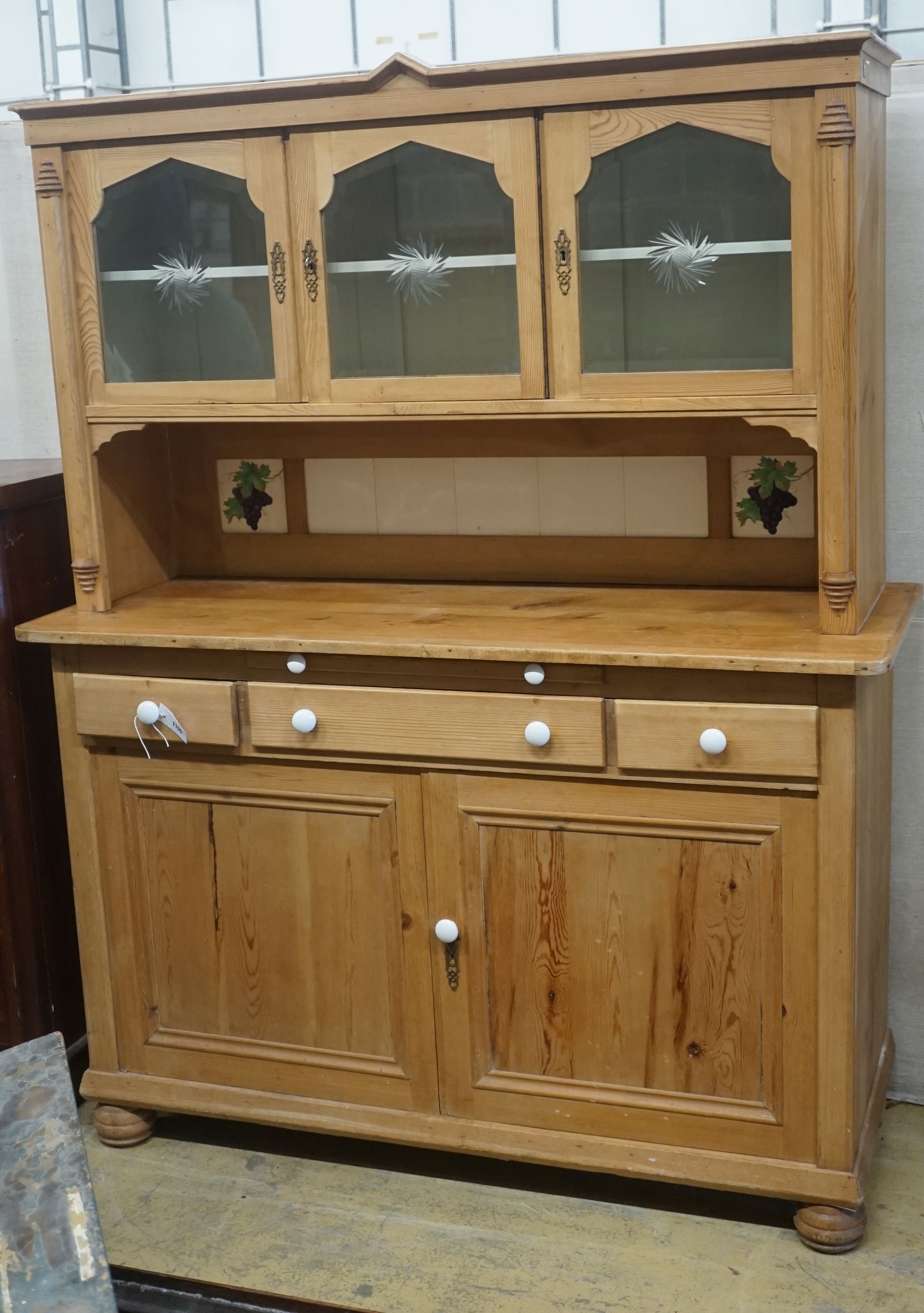 A 19th century Continental pine glazed side cabinet, width 142cm, depth 55cm, height 180cm